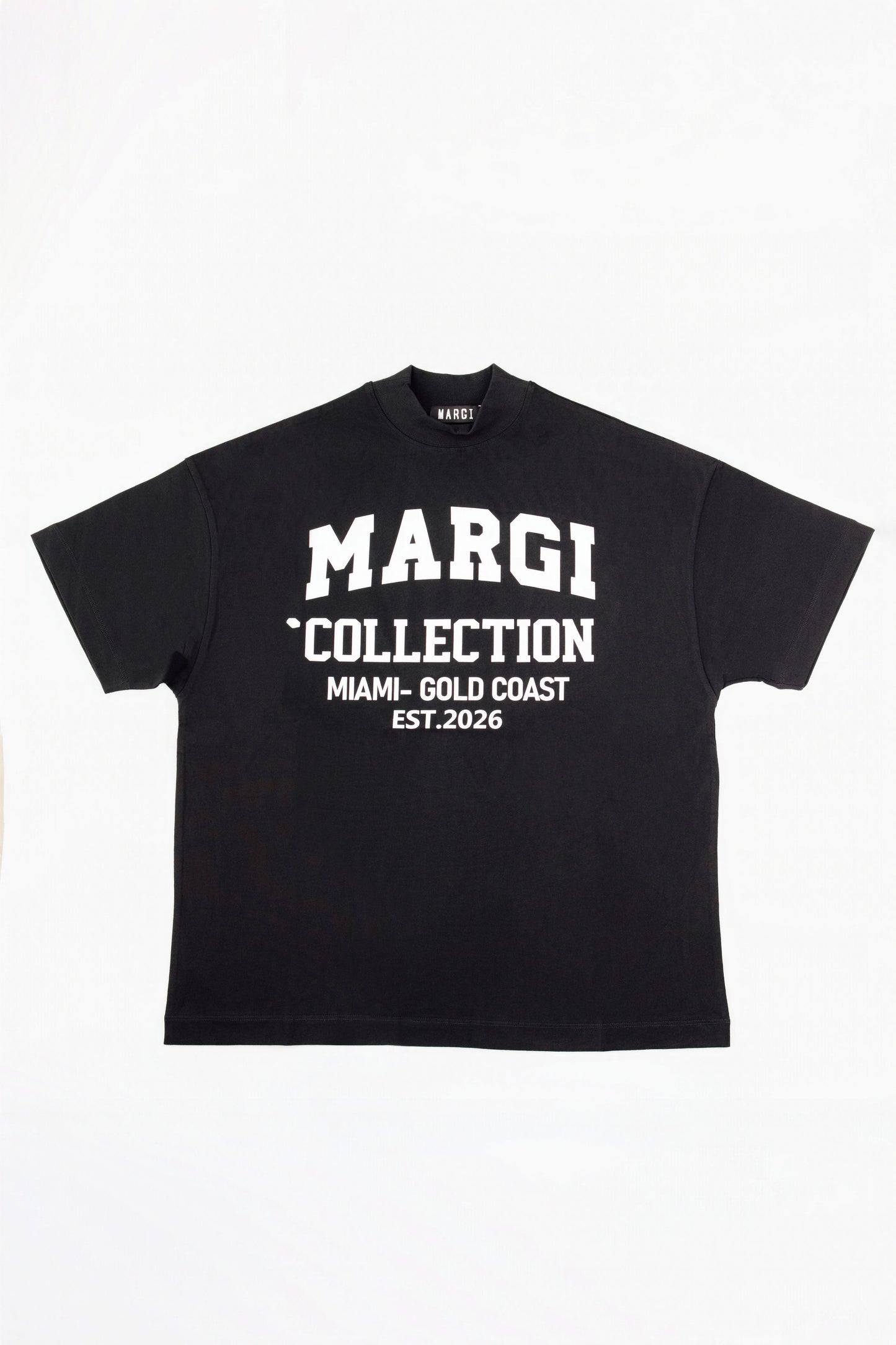 A black short-sleeve t-shirt with white text on the front reading 'MARGI COLLECTION MIAMI-GOLD COAST EST.2026', displayed flat against a white background.